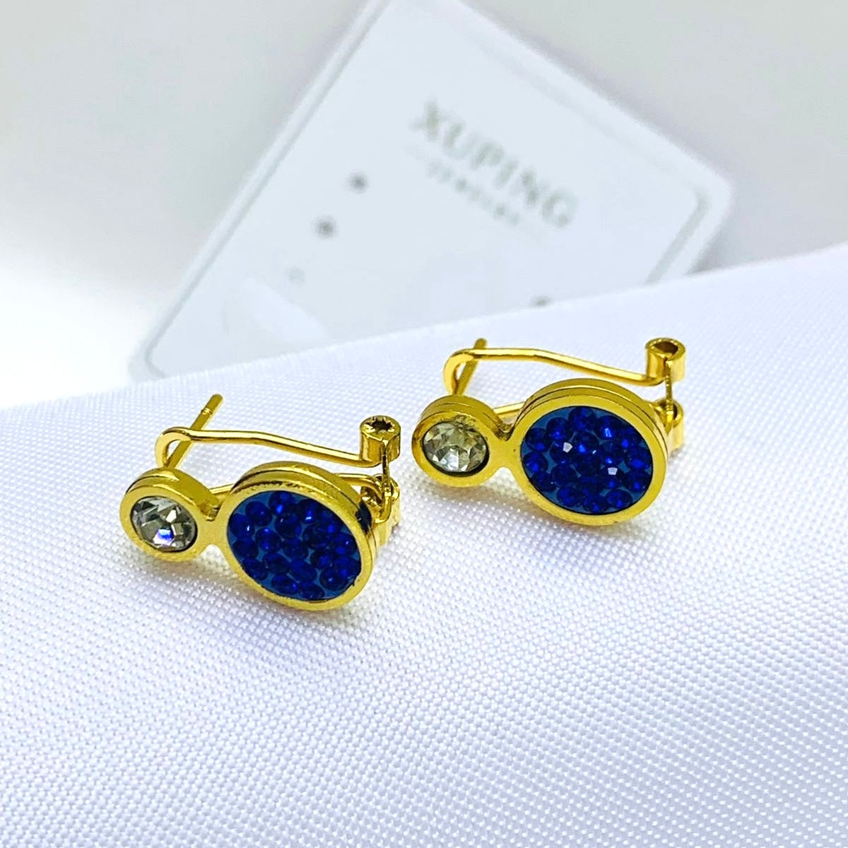 Arete Rodio Dorado Circón azul